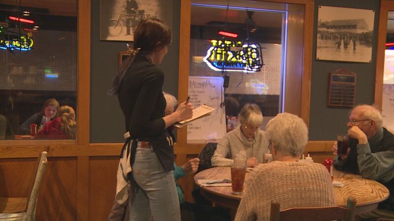A waitress takes orders at a Ramsey's Diner in Lexington on Friday, November 19, 2021.