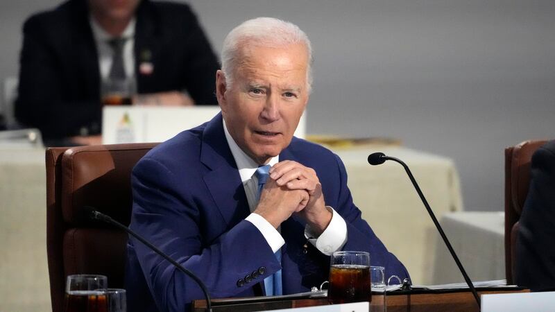 President Joe Biden speaks while sitting next to other leaders during the Asia-Pacific...